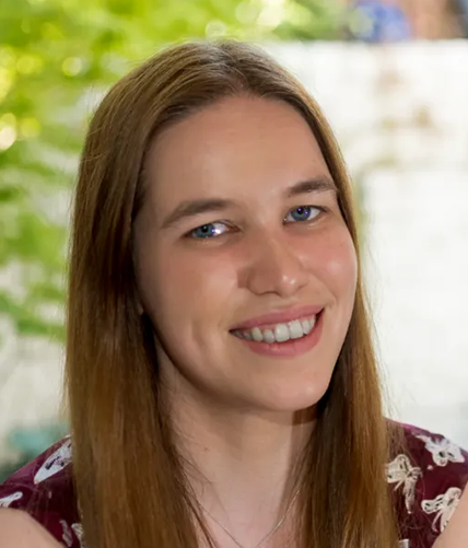 A woman smiling into the camera